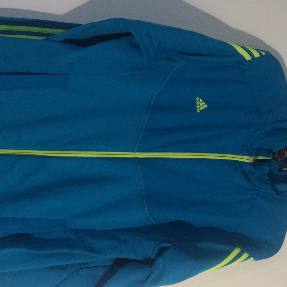 Blue Adidas sweater.